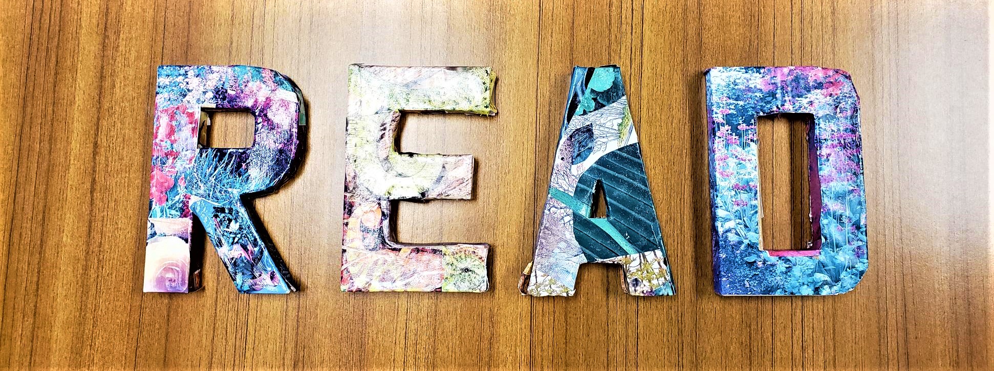 Cardboard letters spell READ